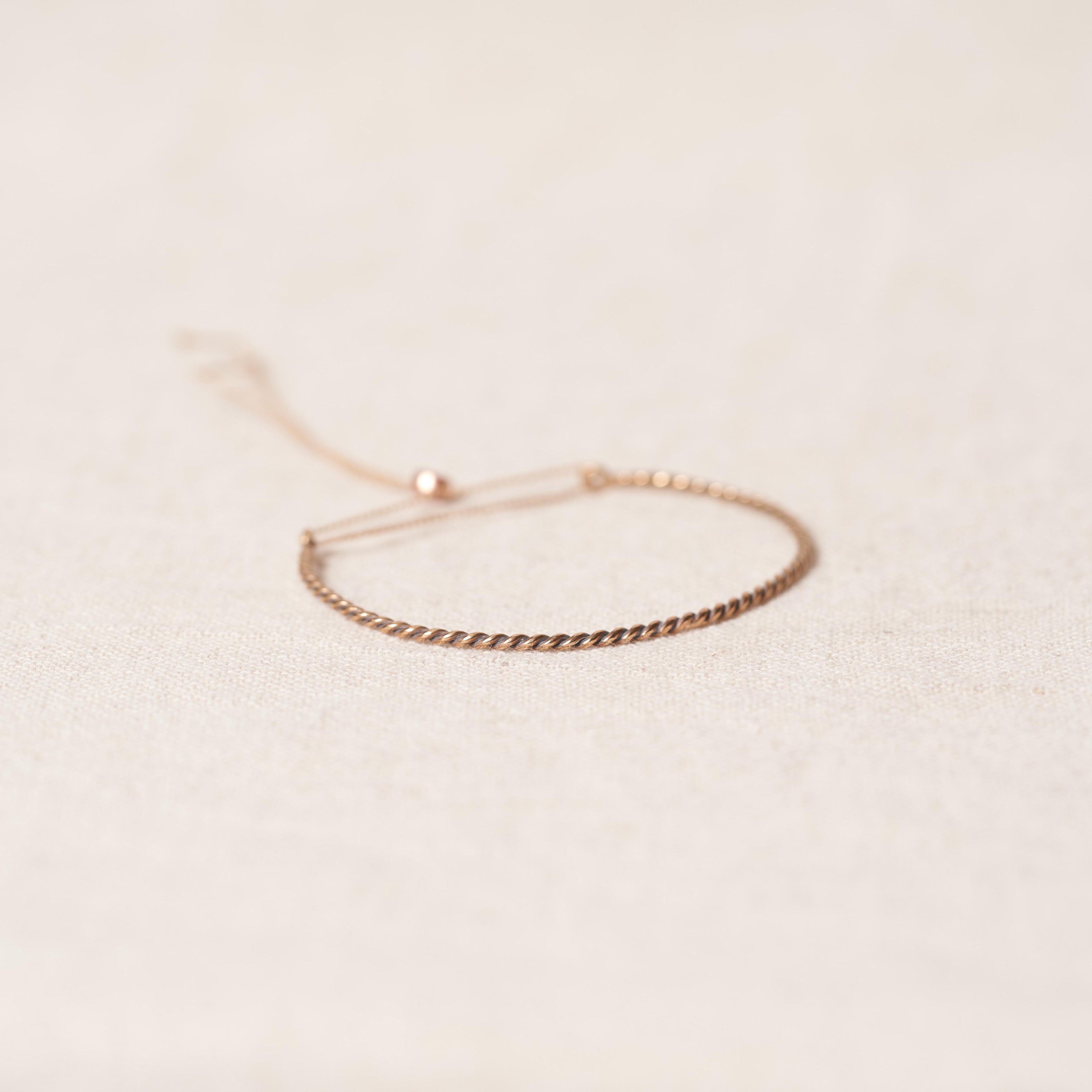Open twist bracelet in rosebronze