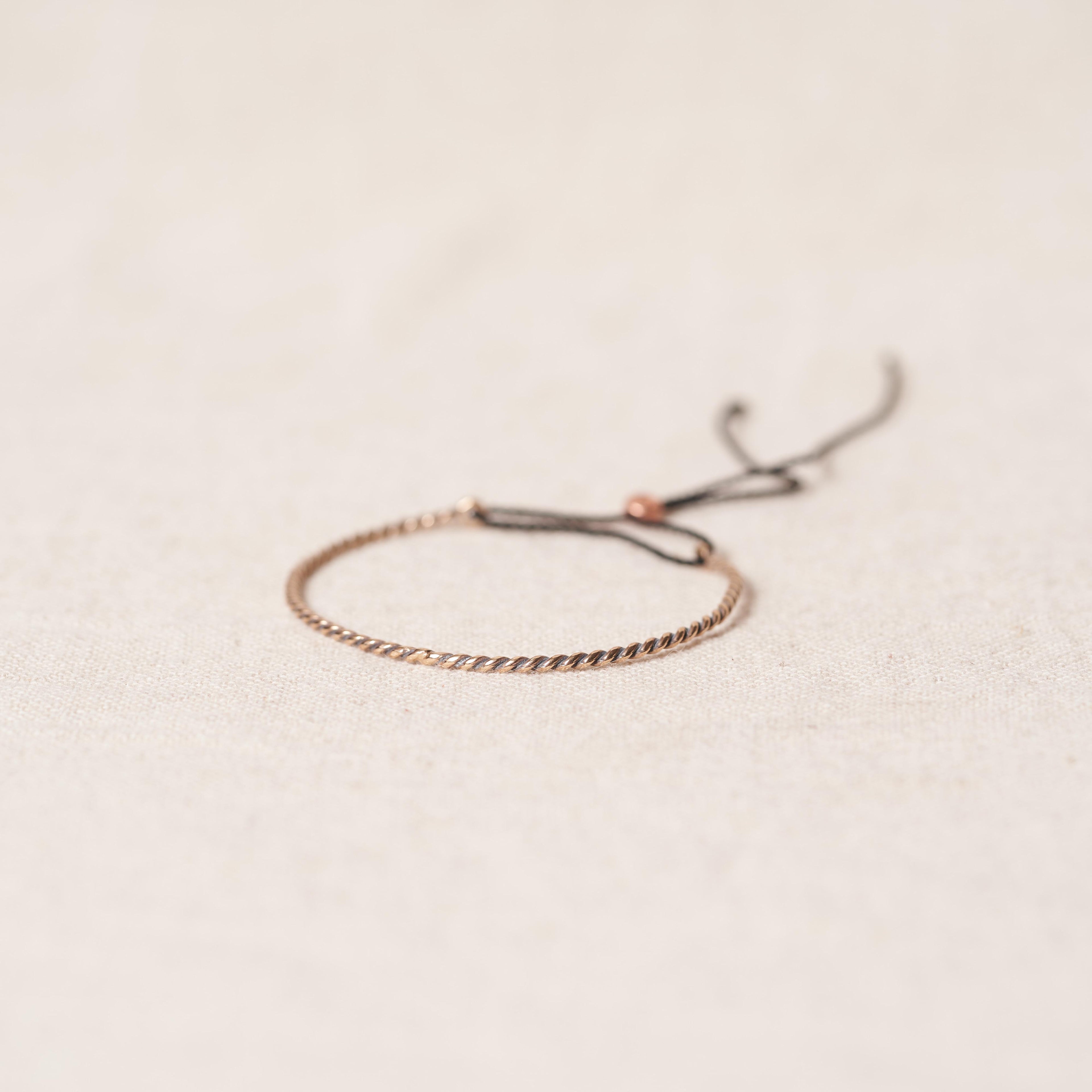 Open twist bracelet in rosebronze