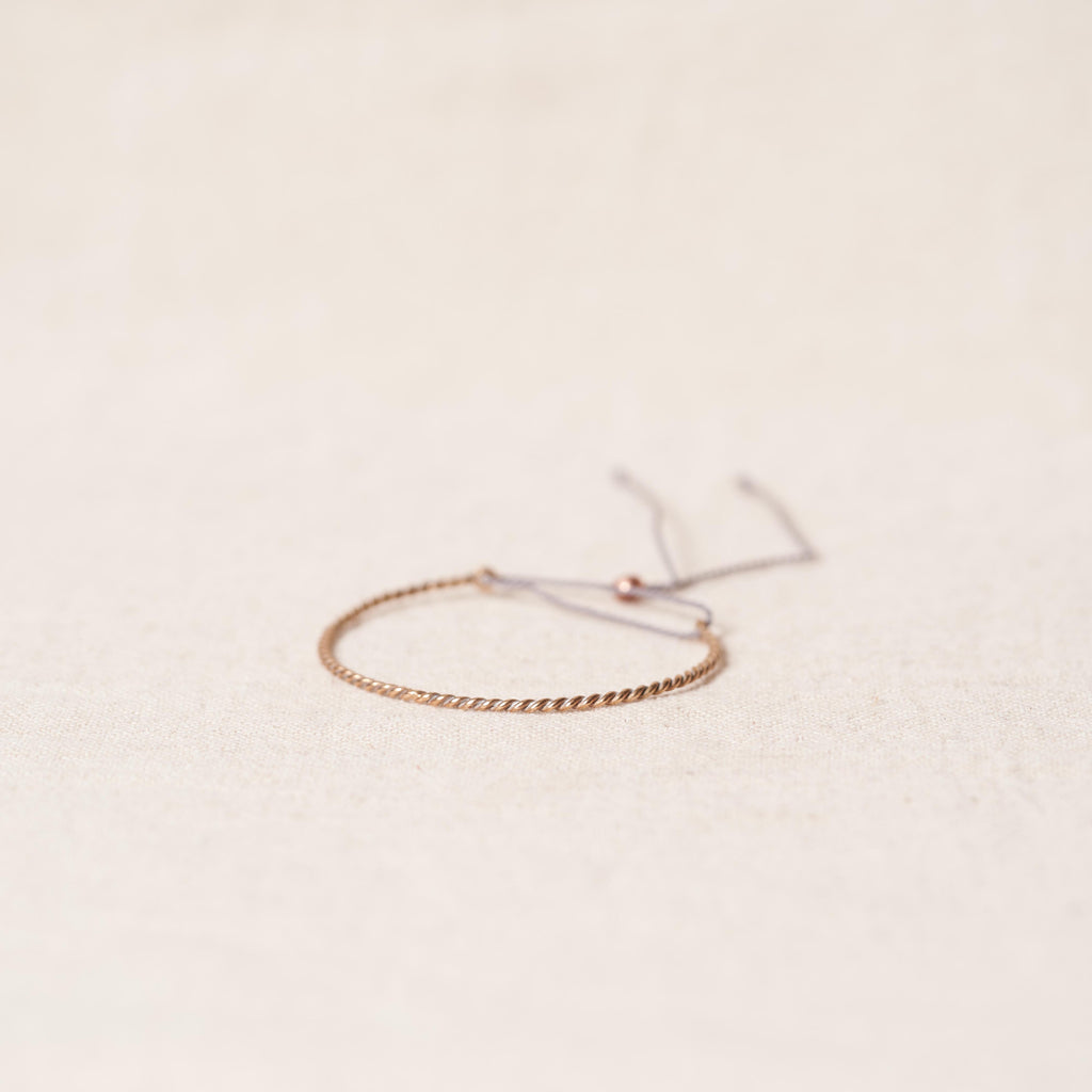 Open twist bracelet in rosebronze
