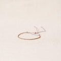 Open twist bracelet in rosebronze