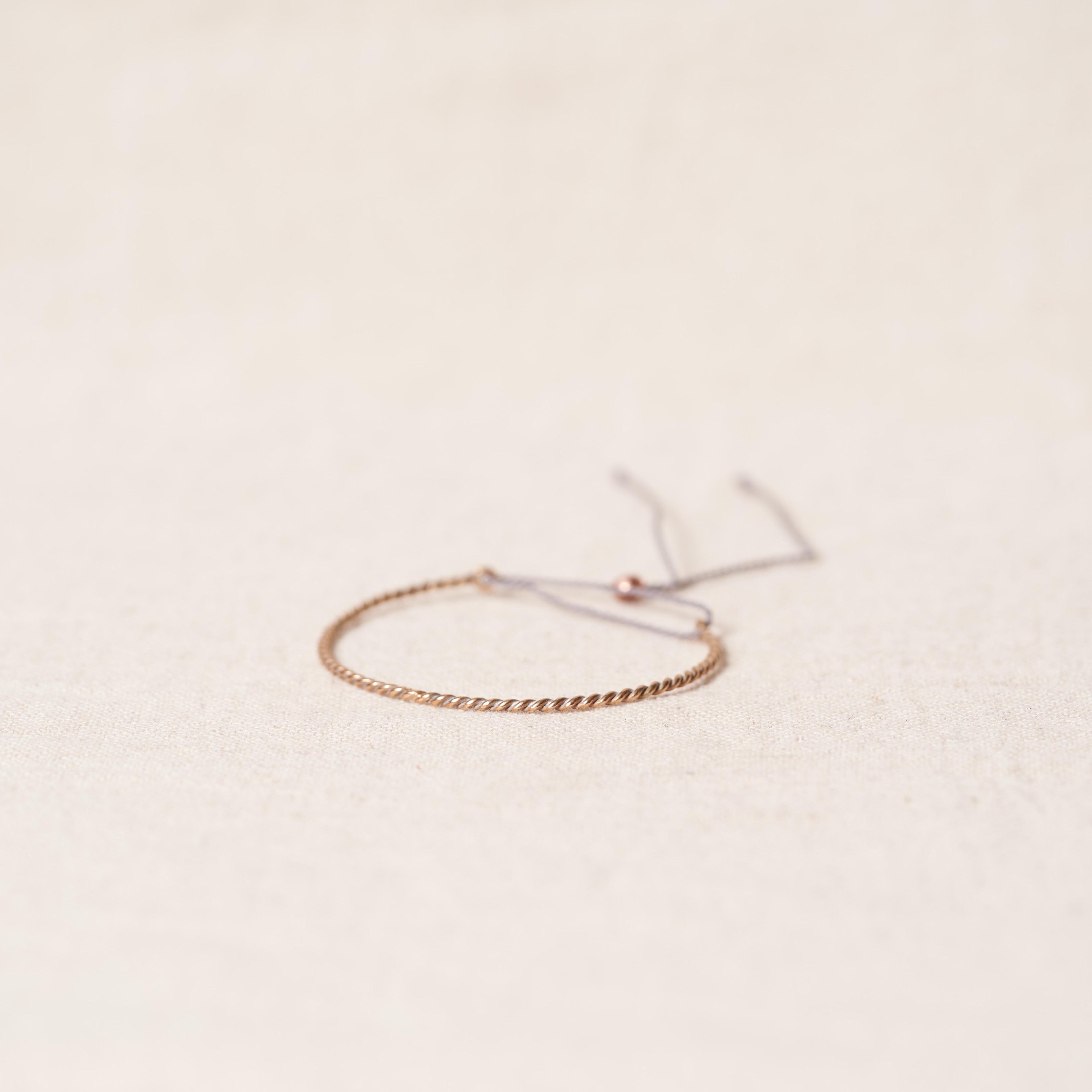 Open twist bracelet in rosebronze