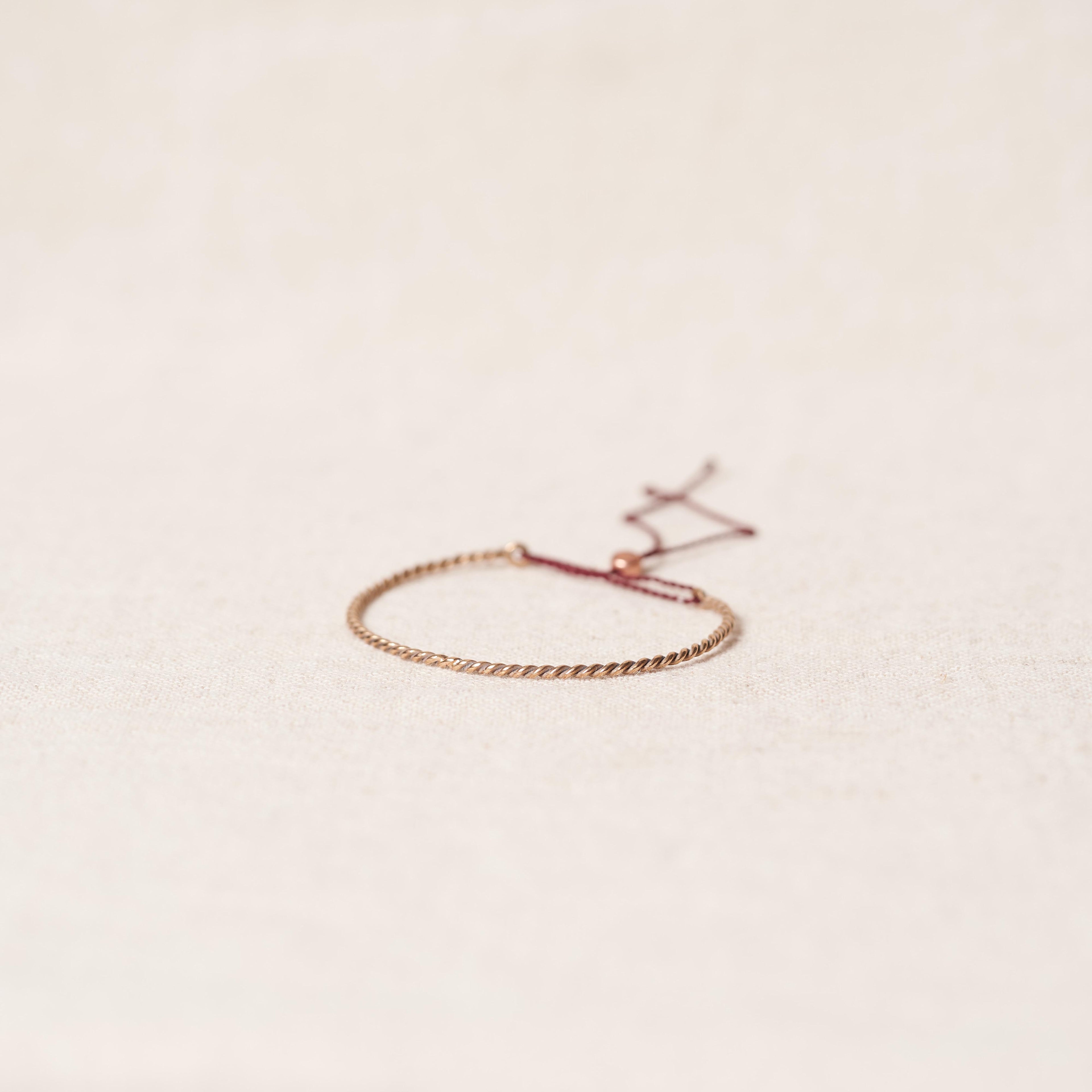 Open twist bracelet in rosebronze