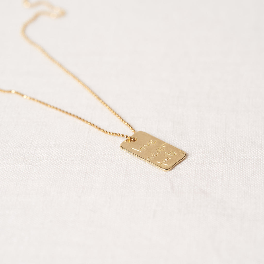 Love never fails necklace