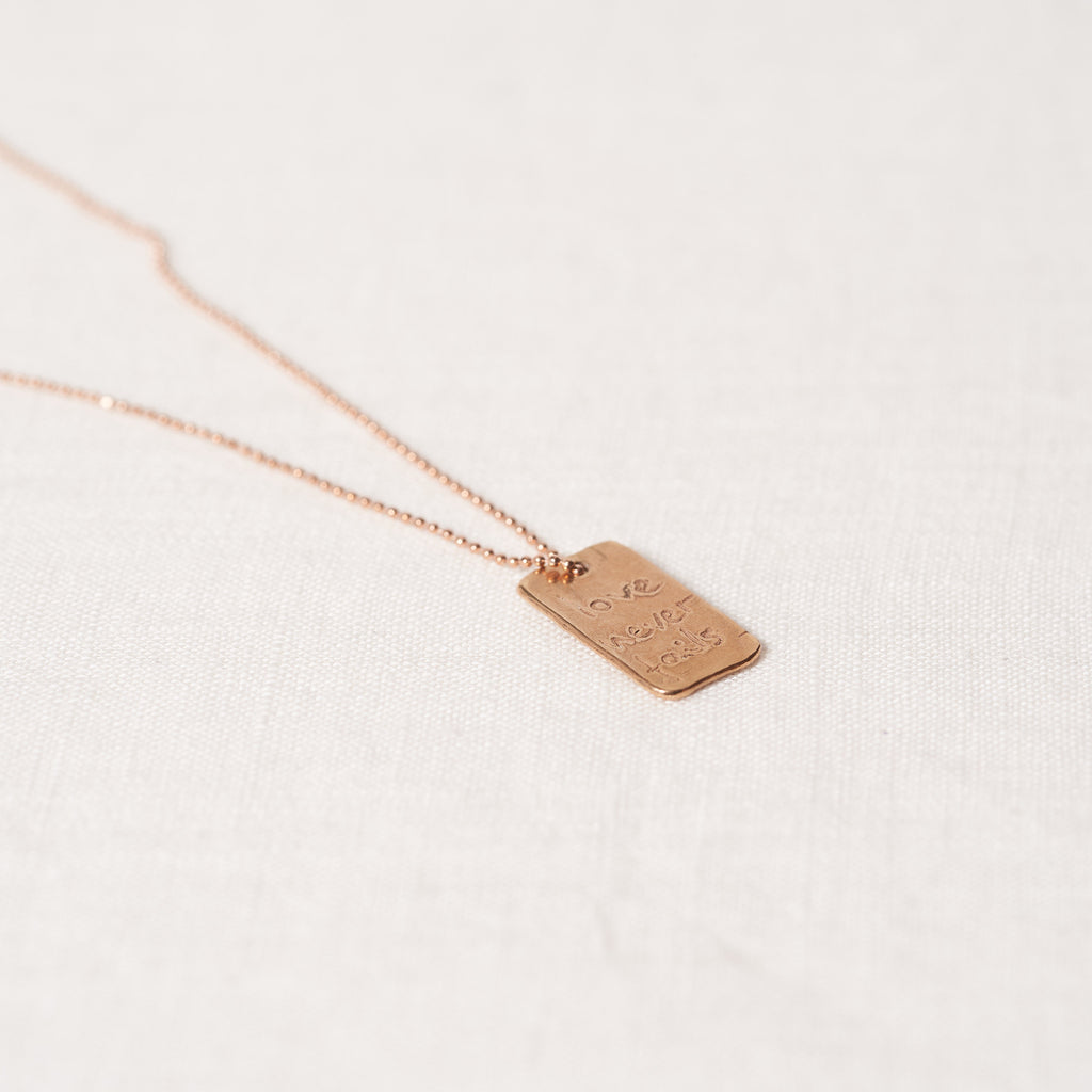 Love never fails necklace