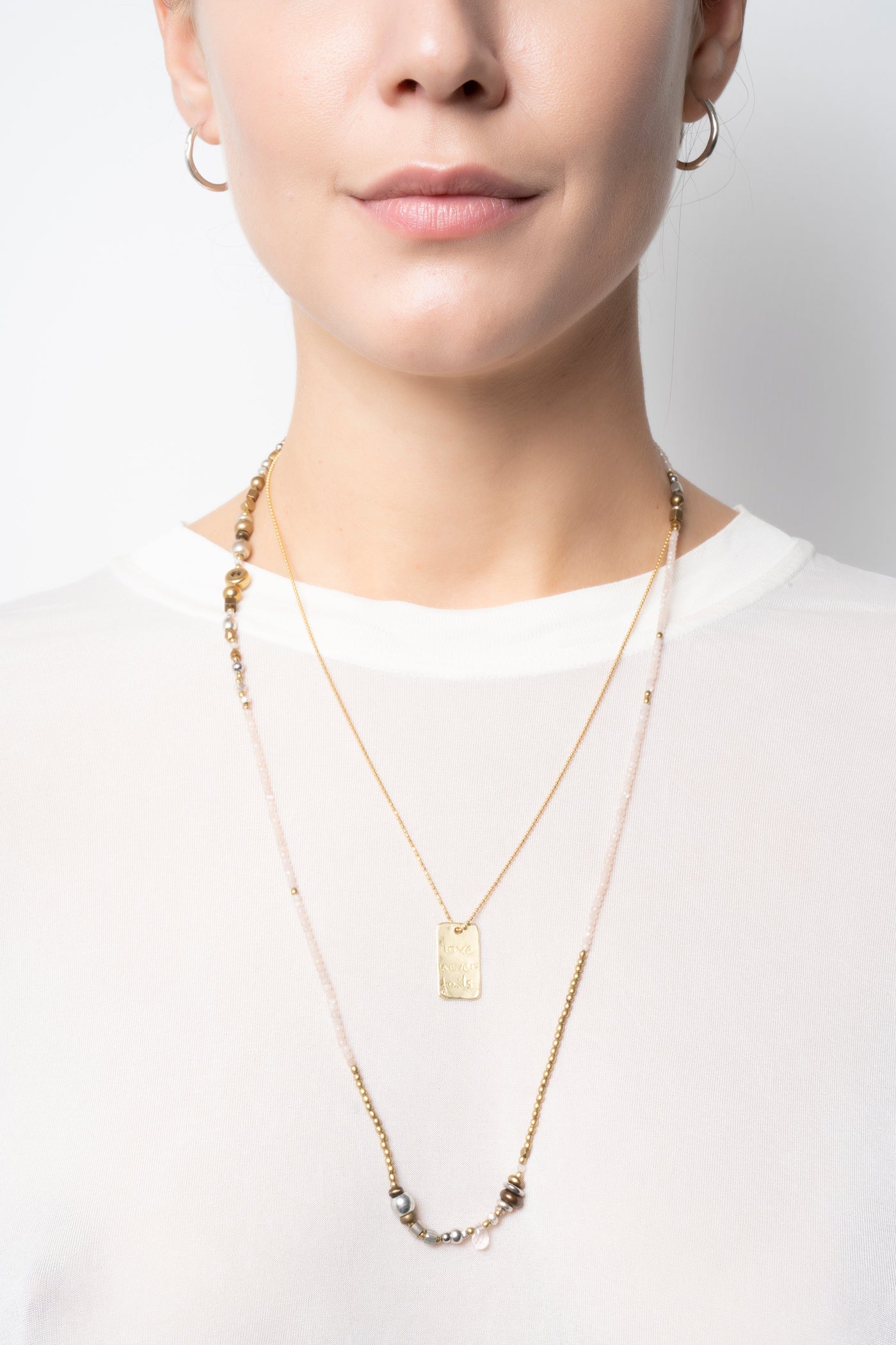 Love never fails necklace